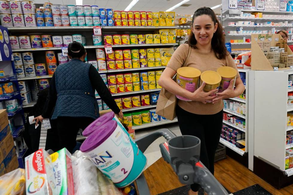 Michelle Saenz of Santee, Calif. buys baby formula at a grocery story across the border, Tuesda ...