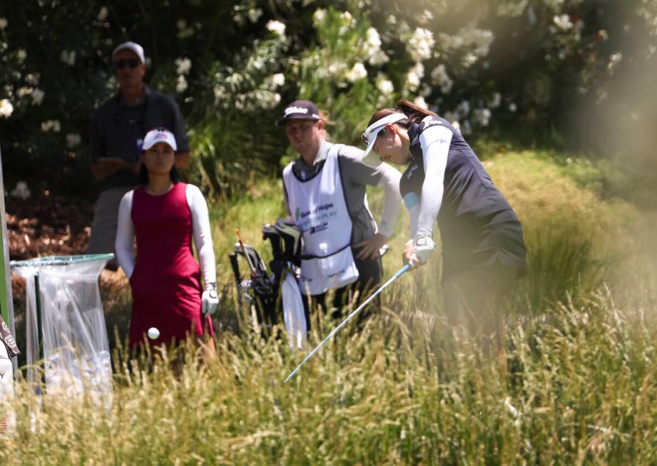 Kelly Tan tees off at the 12th hole while playing against Danielle Kang in the first round of B ...