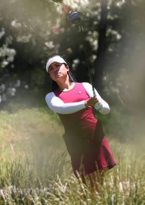 Danielle Kang tees off at the 12th hole while playing against Kelly Tan, not pictured, in the f ...