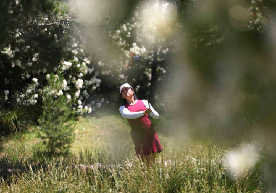 Danielle Kang tees off at the 12th hole while playing against Kelly Tan, not pictured, in the f ...