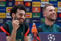 Liverpool's Mohamed Salah, left, and Liverpool's Jordan Henderson address the media during a pr ...