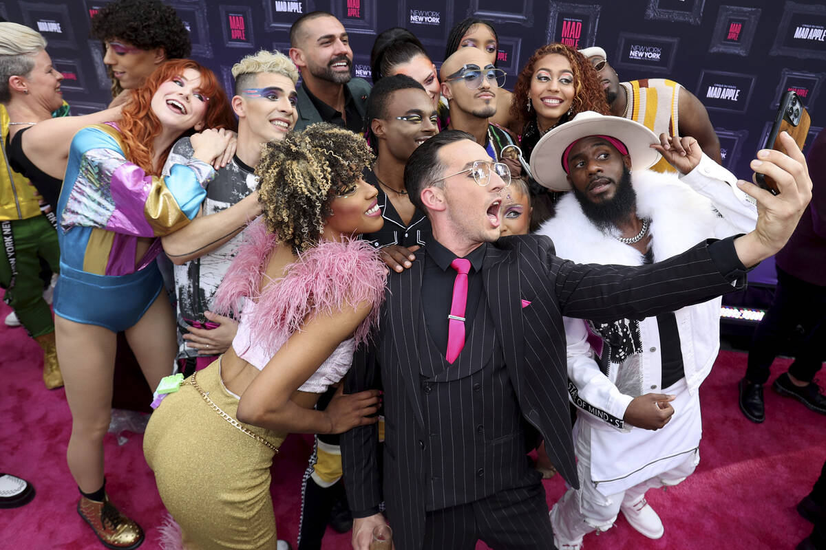 Paul Dabek takes a selfie with fellow cast members on the “pink carpet” for the premier of ...