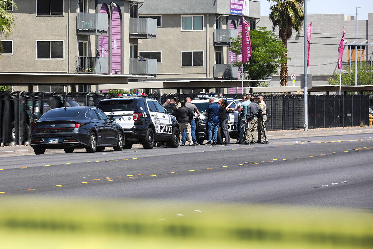 Police at the scene of a fatal shooting in central Las Vegas, Sunday, April 24, 2022. (Rachel A ...
