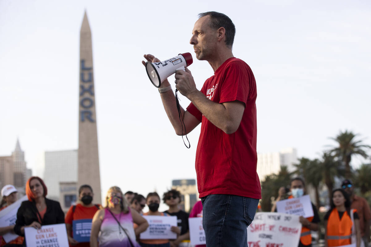 Clark County Commissioner Justin Jones speaks during a rally and march by Moms Demand Action an ...