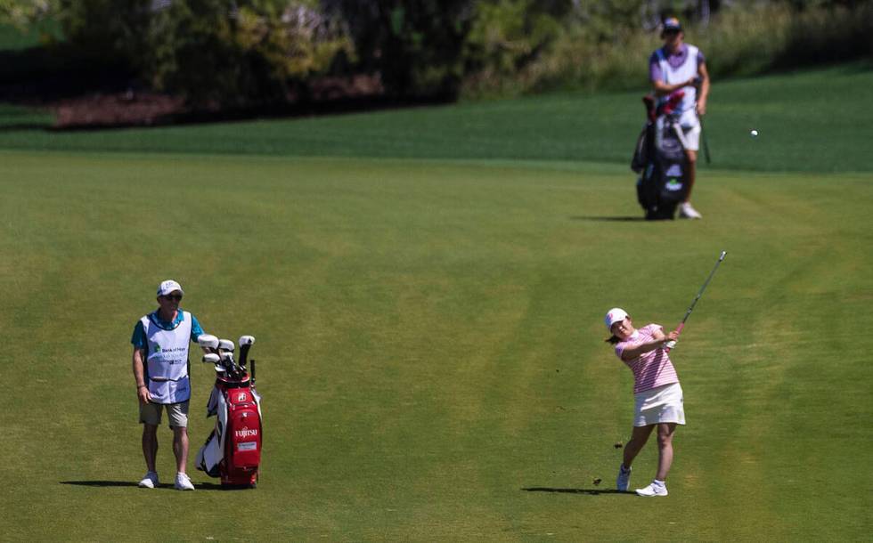 Lilia Vu, right, hits off the fairway of the 6th hole during the fourth day of the LPGA Bank of ...