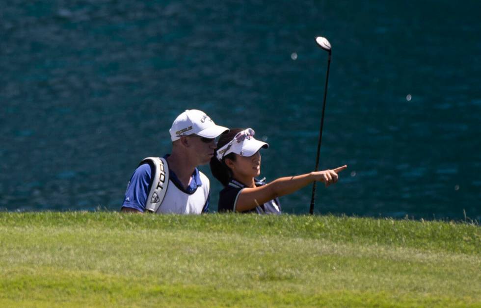 Andrea Lee, right, consults with her caddy during the final day of the LPGA Bank of Hope Match ...