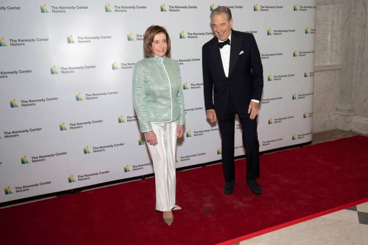 FILE - House Speaker Nancy Pelosi, D-Calif., and her husband, Paul Pelosi, pose on the red carp ...