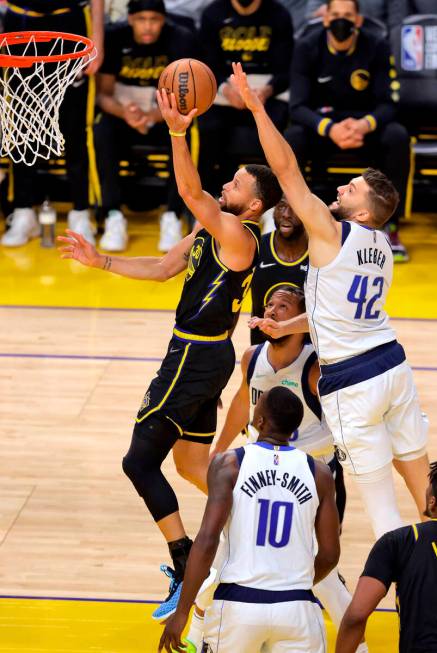 Golden State Warriors' Stephen Curry (30) next to Dallas Mavericks' Maxi Kleber in Game 5 of th ...