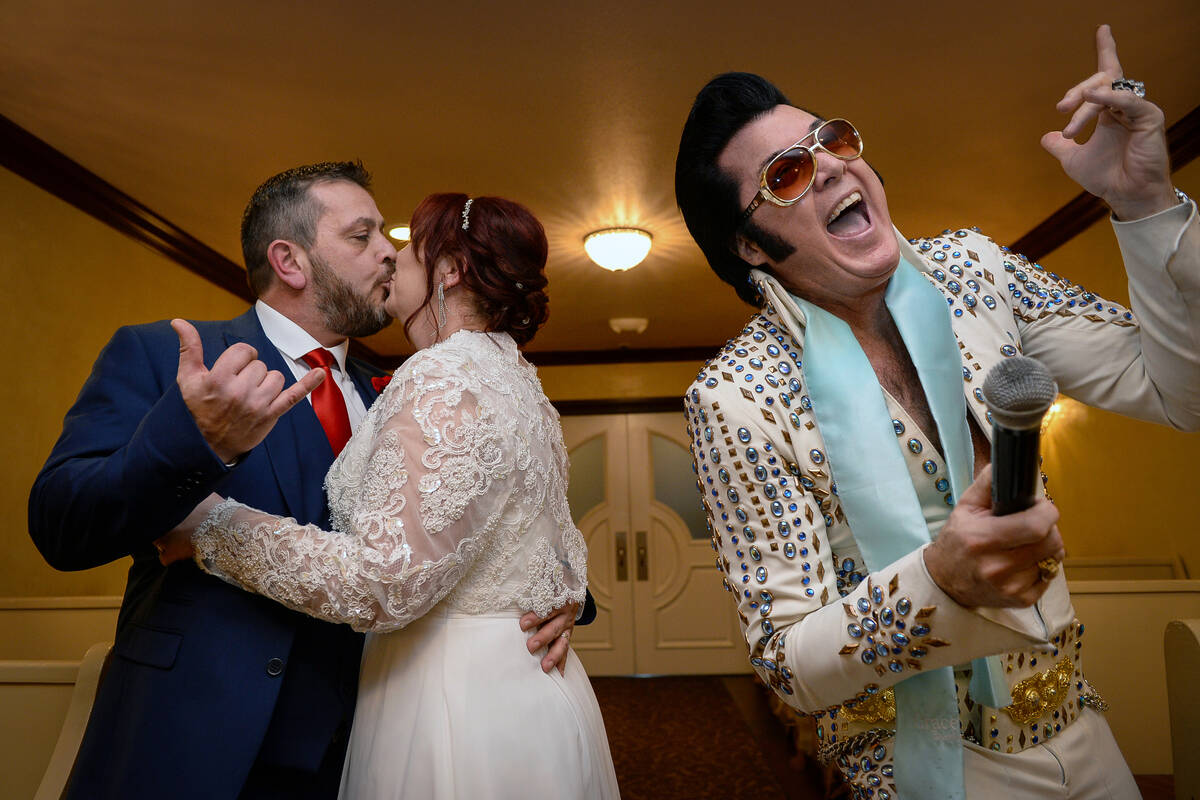 After 35 years together, Hugo and Sally Knight from Ireland kiss during their wedding ceremony ...