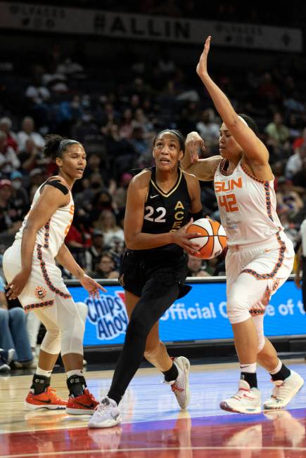 Las Vegas Aces forward A'ja Wilson (22) shoots against Connecticut Sun center Brionna Jones (42 ...