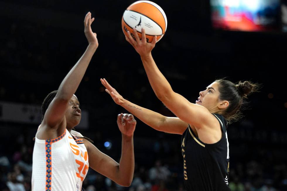 Las Vegas Aces guard Kelsey Plum (10) shoots against Connecticut Sun forward Jonquel Jones (35) ...