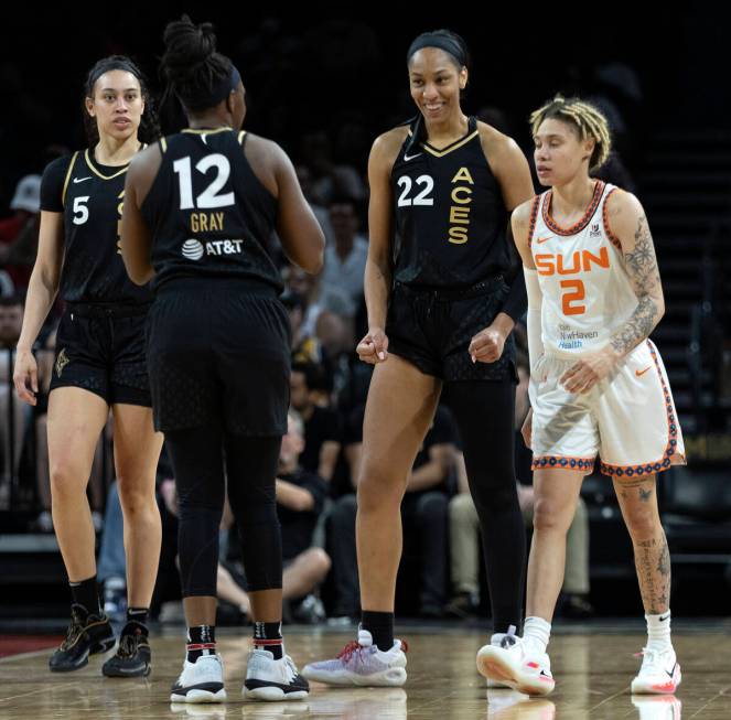 Las Vegas Aces forward A'ja Wilson (22) and guard Chelsea Gray (12) celebrate a foul called on ...