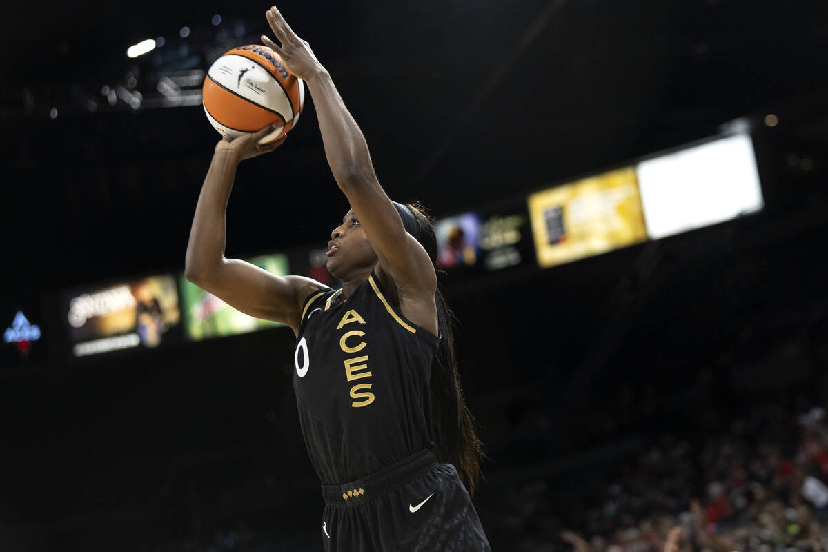 Las Vegas Aces guard Jackie Young (0) shoots against the Connecticut Sun during the second half ...