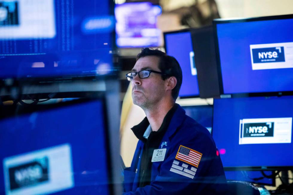 Specialist John McNierney works at his post on the floor, Friday, May 27, 2022, in New York. ( ...