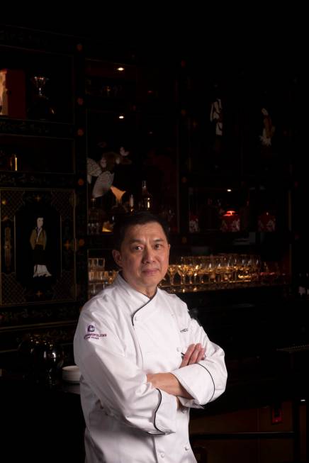 Chef Yip Cheung poses for a portrait at the bar inside Red Plate, a Chinese restaurant in the C ...