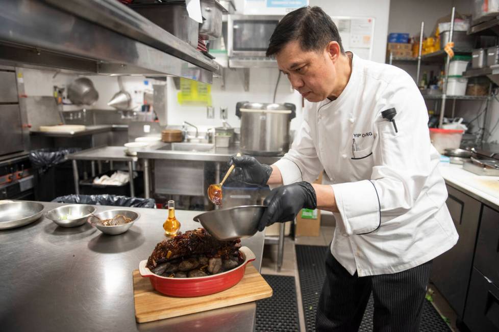 Chef Yip Cheung prepares the Chef's Special Short Rib Served on Ishiyaki Sizzling Stones at Red ...
