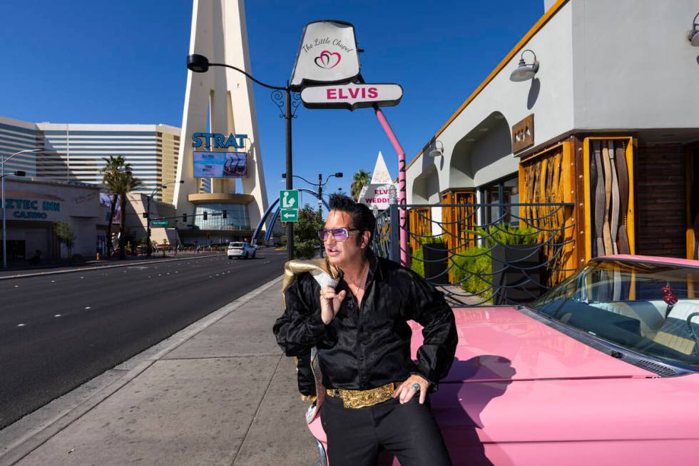 Elvis tribute artist Jesse Garon poses with his 1960 Cadillac outside of the Little Chapel of H ...