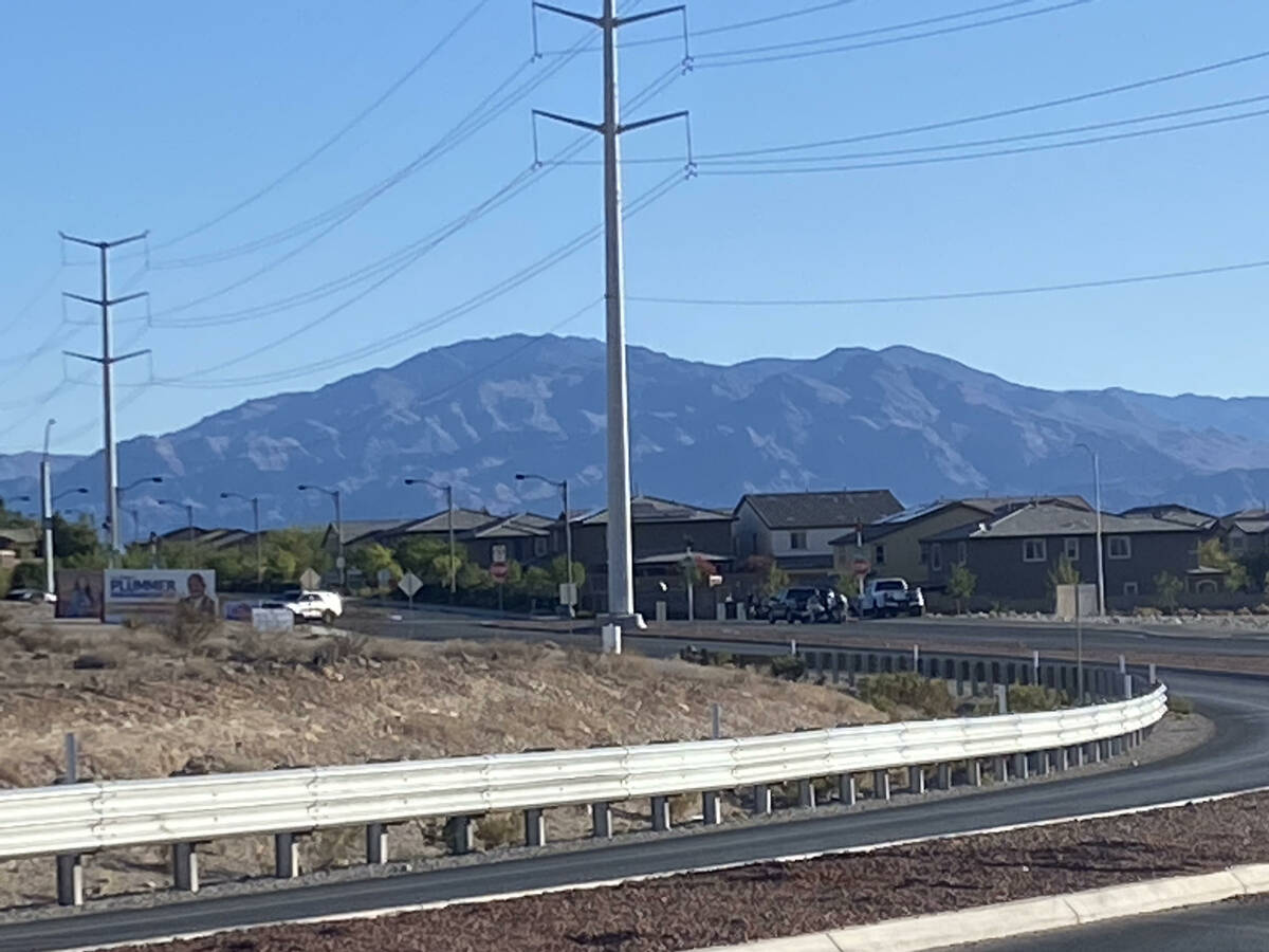 Las Vegas police investigate near the intersection of Centennial Parkway and Shaumber Road afte ...