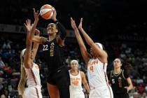 Las Vegas Aces forward A'ja Wilson (22) shoots against Connecticut Sun guard DiJonai Carrington ...