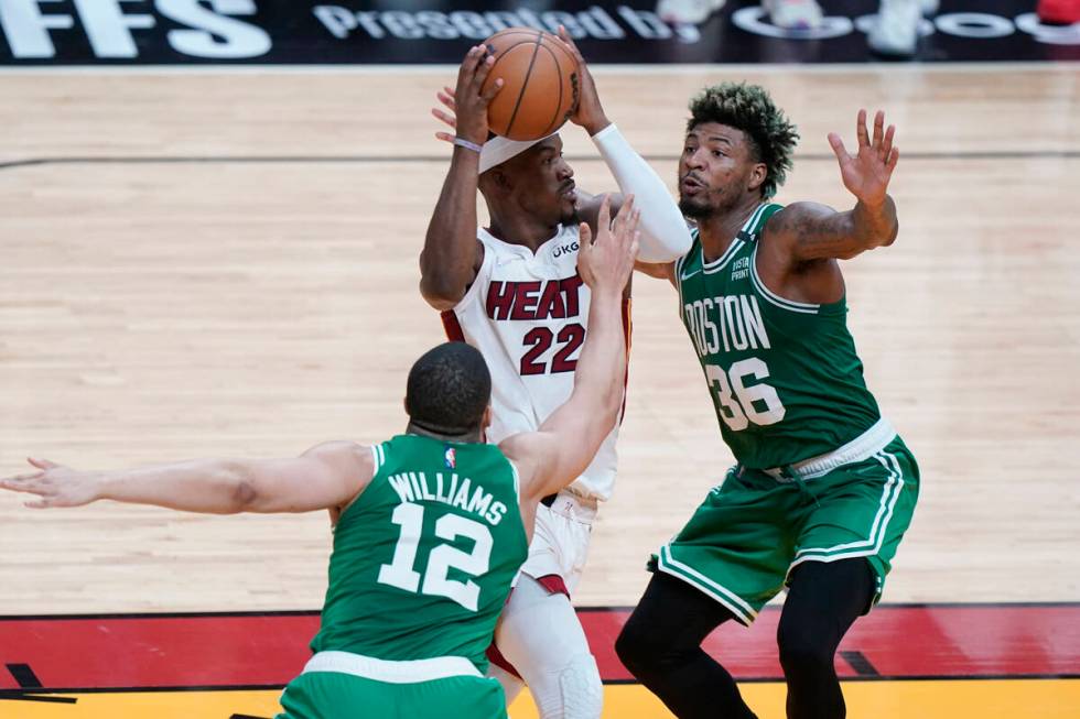 Boston Celtics guard Marcus Smart (36) and forward Grant Williams (12) guard Miami Heat forward ...