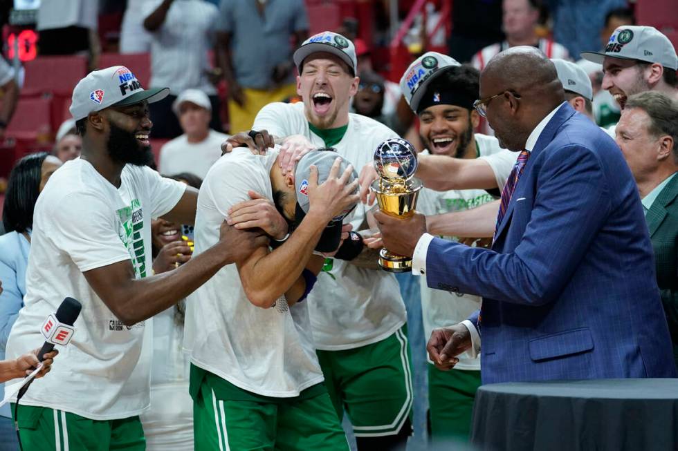 Boston Celtics forward Jayson Tatum (0) receives the NBA Eastern Conference MVP trophy after de ...