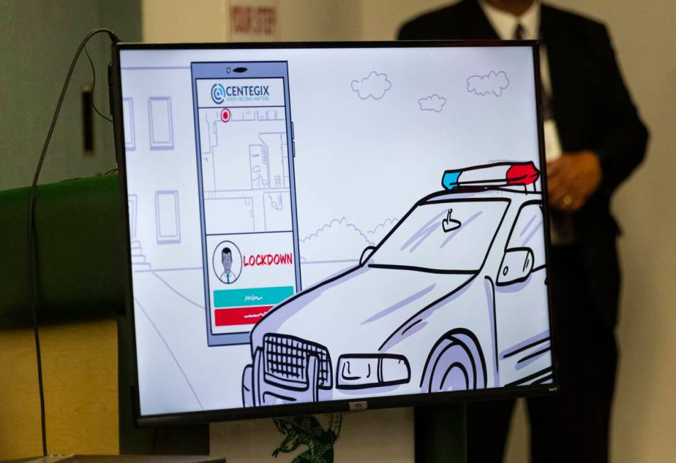 An informational video is played during an event marking the launch of a pilot program using an ...