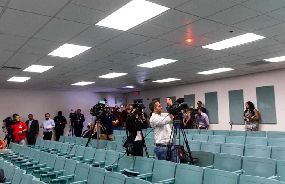 Journalists record as school officials look on during a lockdown demonstration at an event mark ...