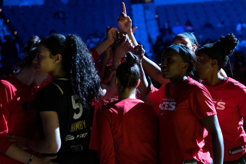 The Las Vegas Aces put their hands together before a WNBA basketball game against the Connectic ...