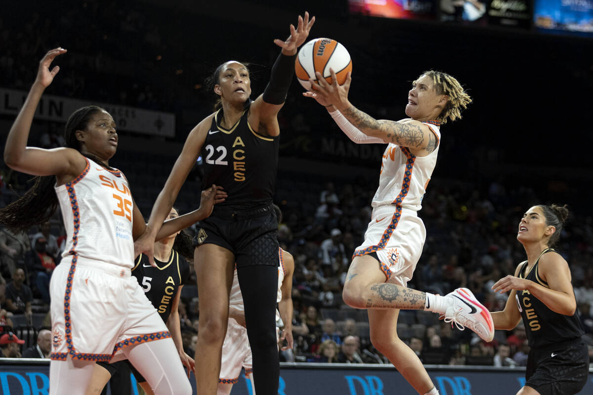 Las Vegas Aces forward A'ja Wilson (22) attempts to block a shot by Connecticut Sun guard Natis ...