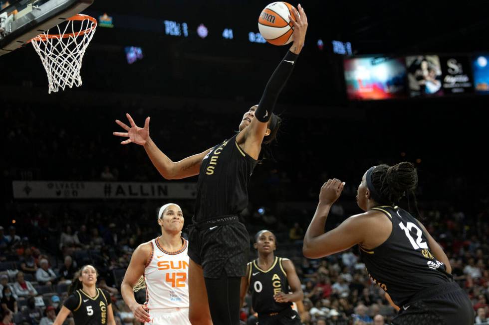 Las Vegas Aces forward A'ja Wilson (22) knocks down a shot by the Connecticut Sun while Las Veg ...