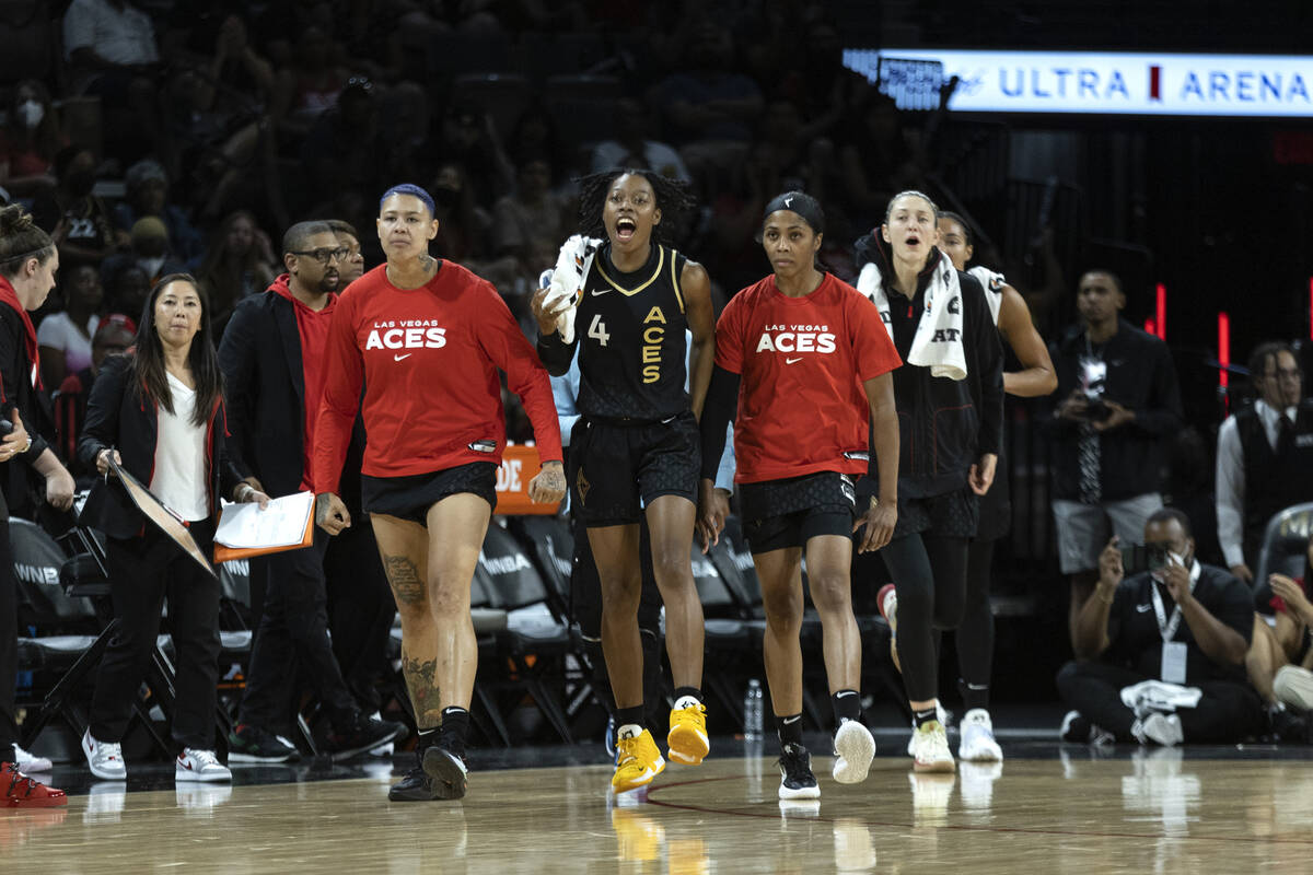 Las Vegas Aces players including guard Kierstan Bell, left, guard Aisha Sheppard (4), guard Syd ...