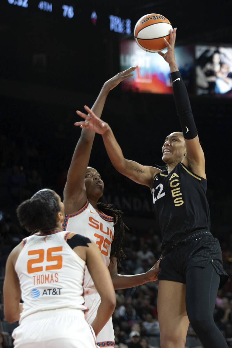 Las Vegas Aces forward A'ja Wilson (22) shoots against Connecticut Sun forward Jonquel Jones (3 ...