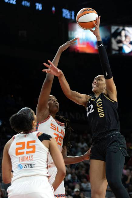 Las Vegas Aces forward A'ja Wilson (22) shoots against Connecticut Sun forward Jonquel Jones (3 ...