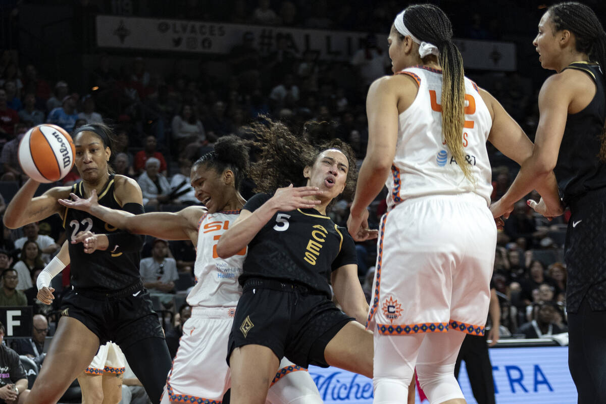 Las Vegas Aces forward Dearica Hamby (5), Connecticut Sun forward Alyssa Thomas (25) and Las Ve ...