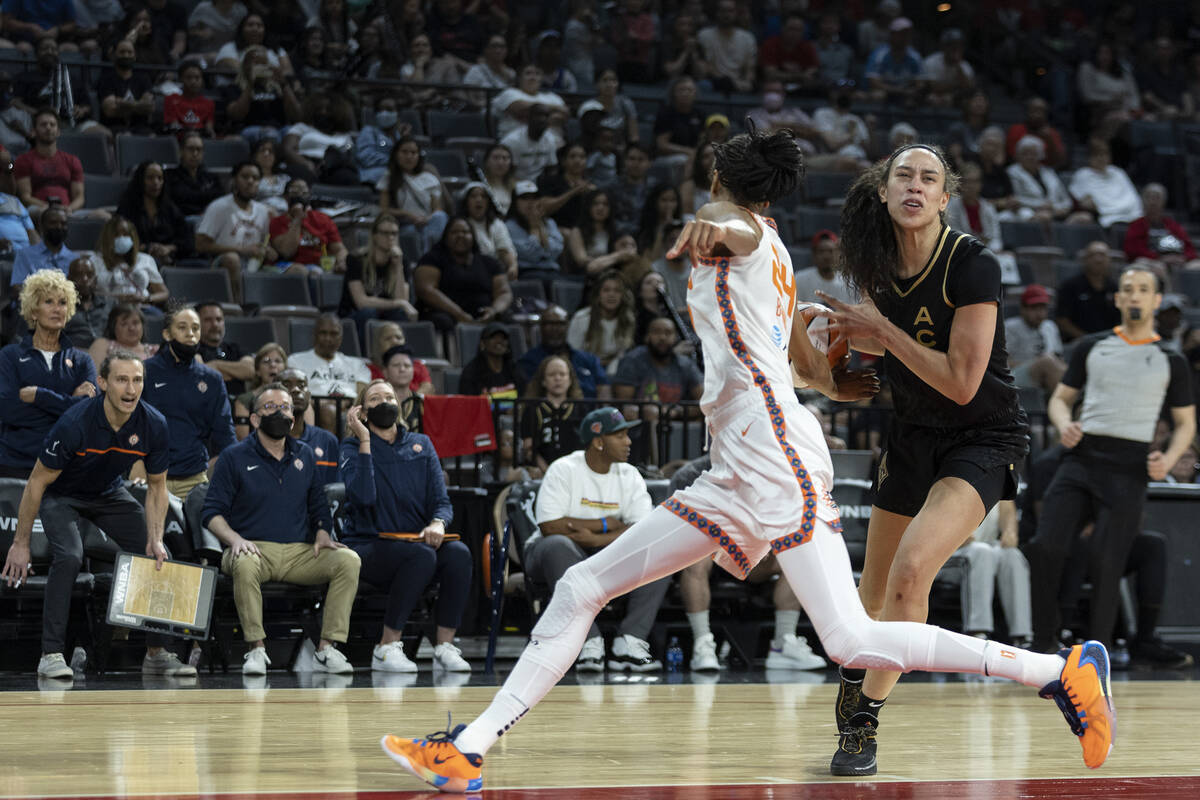 Connecticut Sun forward DeWanna Bonner (24) knocks the ball away from Las Vegas Aces forward De ...