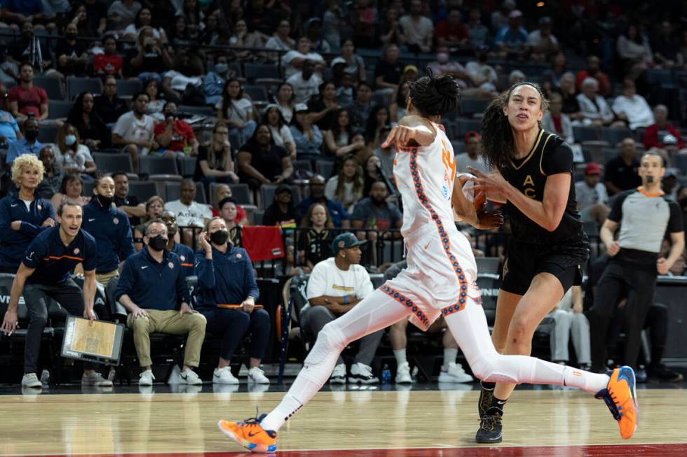 Connecticut Sun forward DeWanna Bonner (24) knocks the ball away from Las Vegas Aces forward De ...