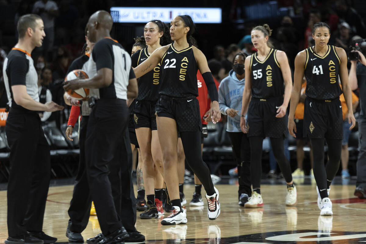 Las Vegas Aces players forward Dearica Hamby, center left, forward A'ja Wilson (22), forward Th ...