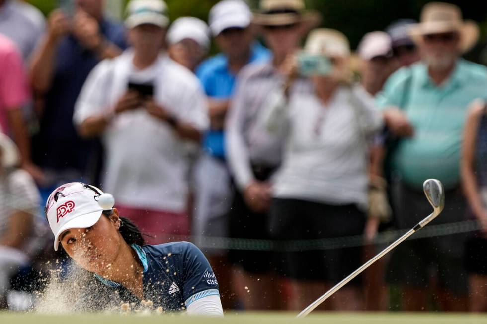 Danielle Kang hits out of the bunker on the 18th hole during the second round of the U.S. Women ...