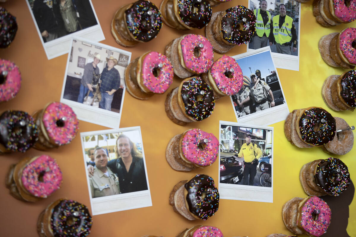 A donut wall features photos of Officer Phil Closi, a Metropolitan police officer who died of C ...