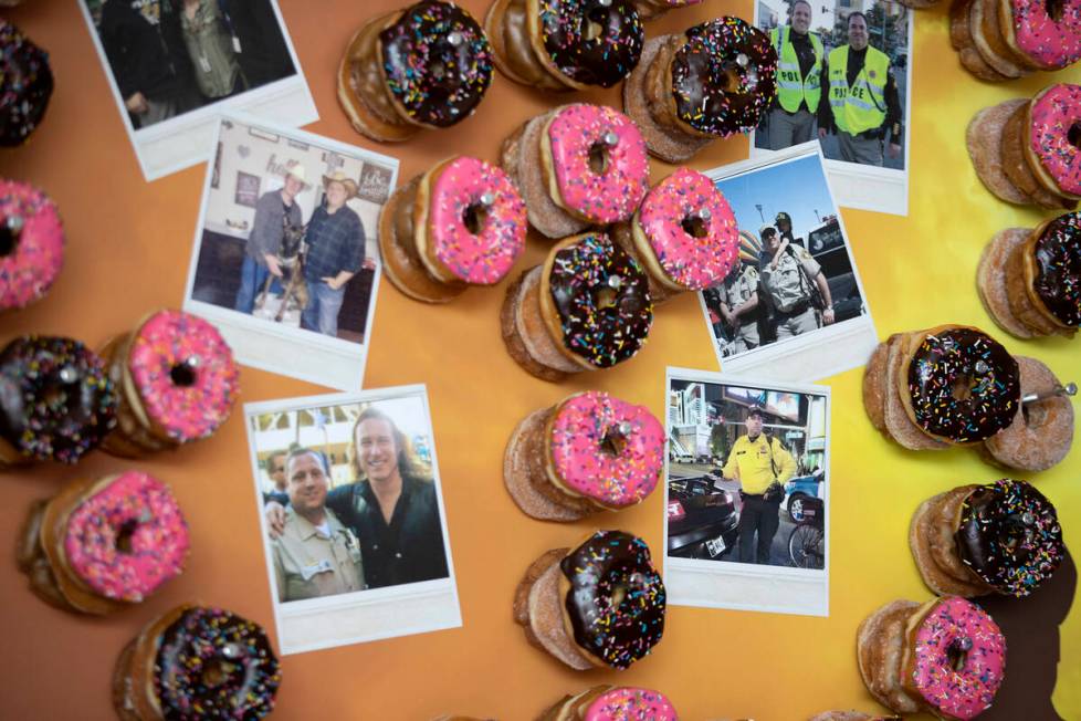 A donut wall features photos of Officer Phil Closi, a Metropolitan police officer who died of C ...