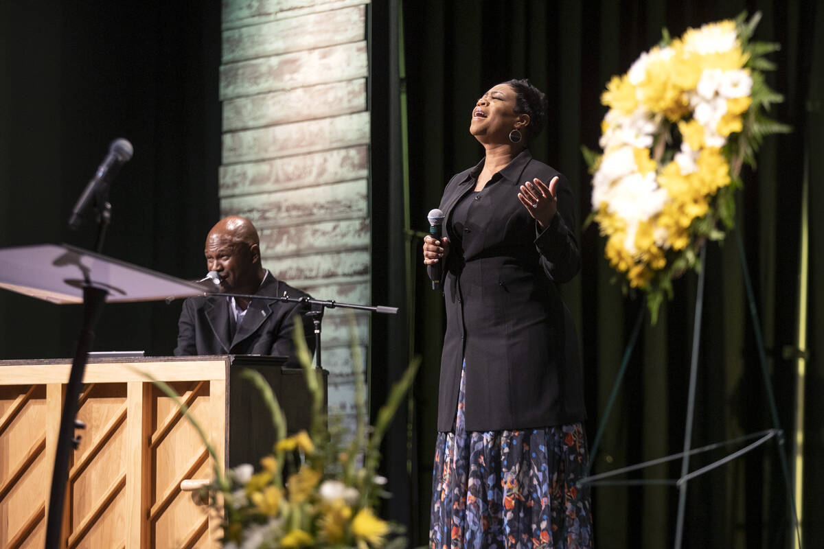 Derwin Ashley, left, and Kay Ashley perform gospel music during a funeral for Officer Phil Clos ...