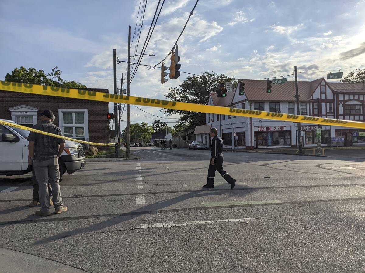 The Chattanooga Police Department investigate the scene following a shooting on Sunday, June 5, ...