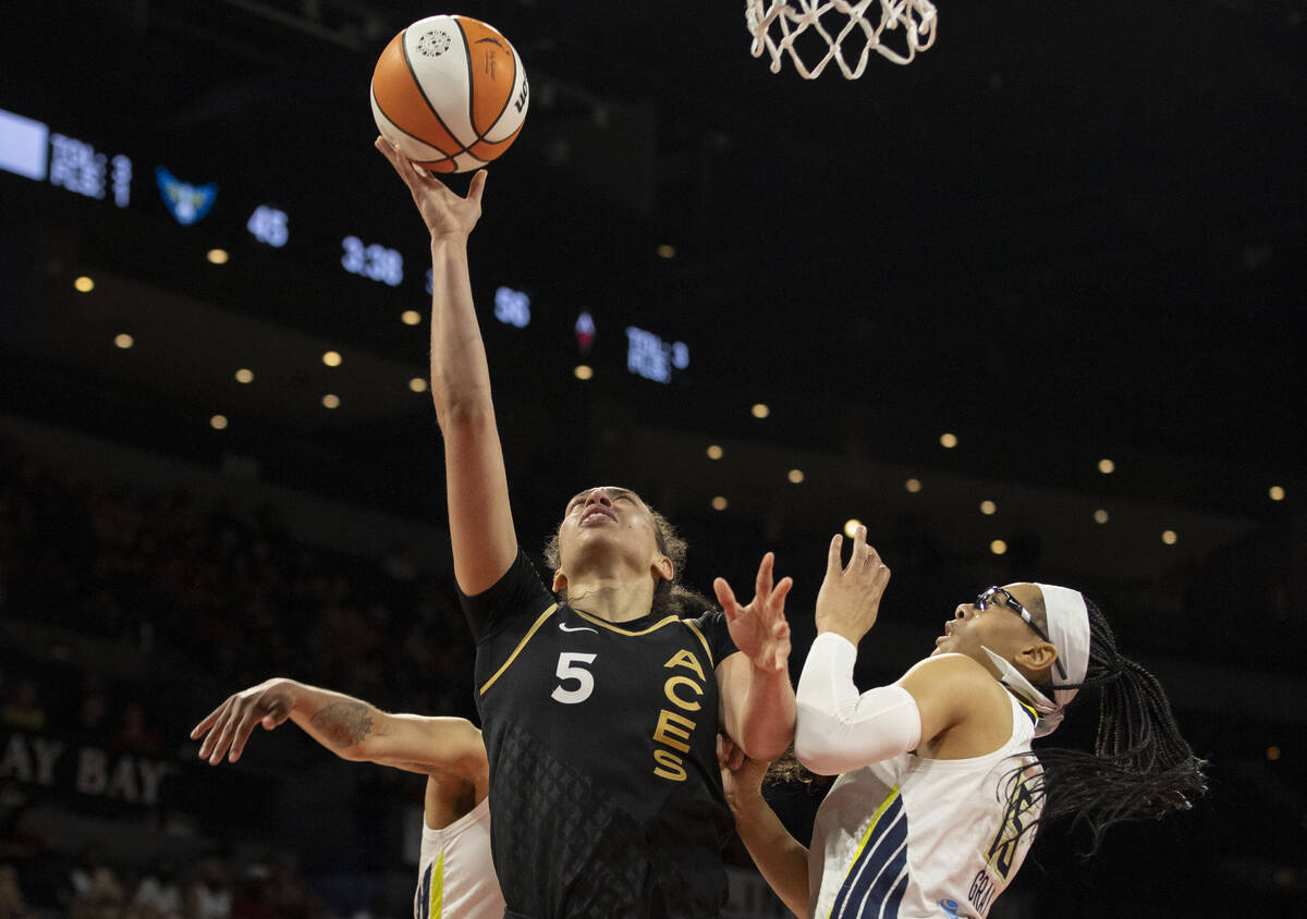 Aces forward Dearica Hamby (5) shoots over Dallas Wings guard Allisha Gray (15) in the second h ...