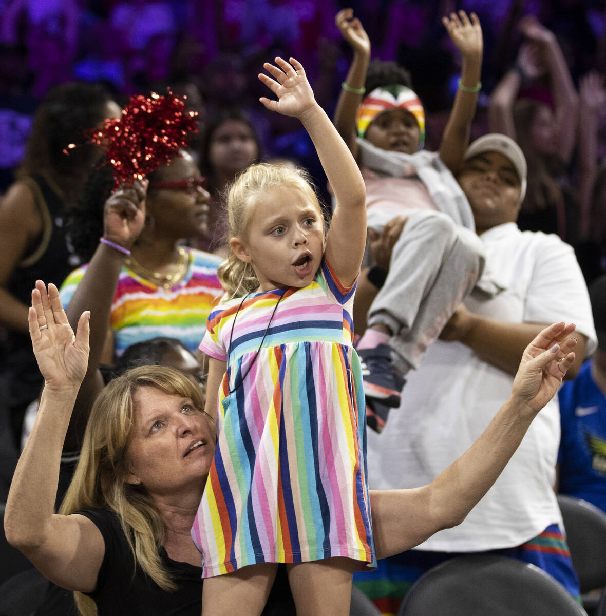 Fans cheer for Vegas in the second half during a WNBA basketball game against the Dallas Wings ...