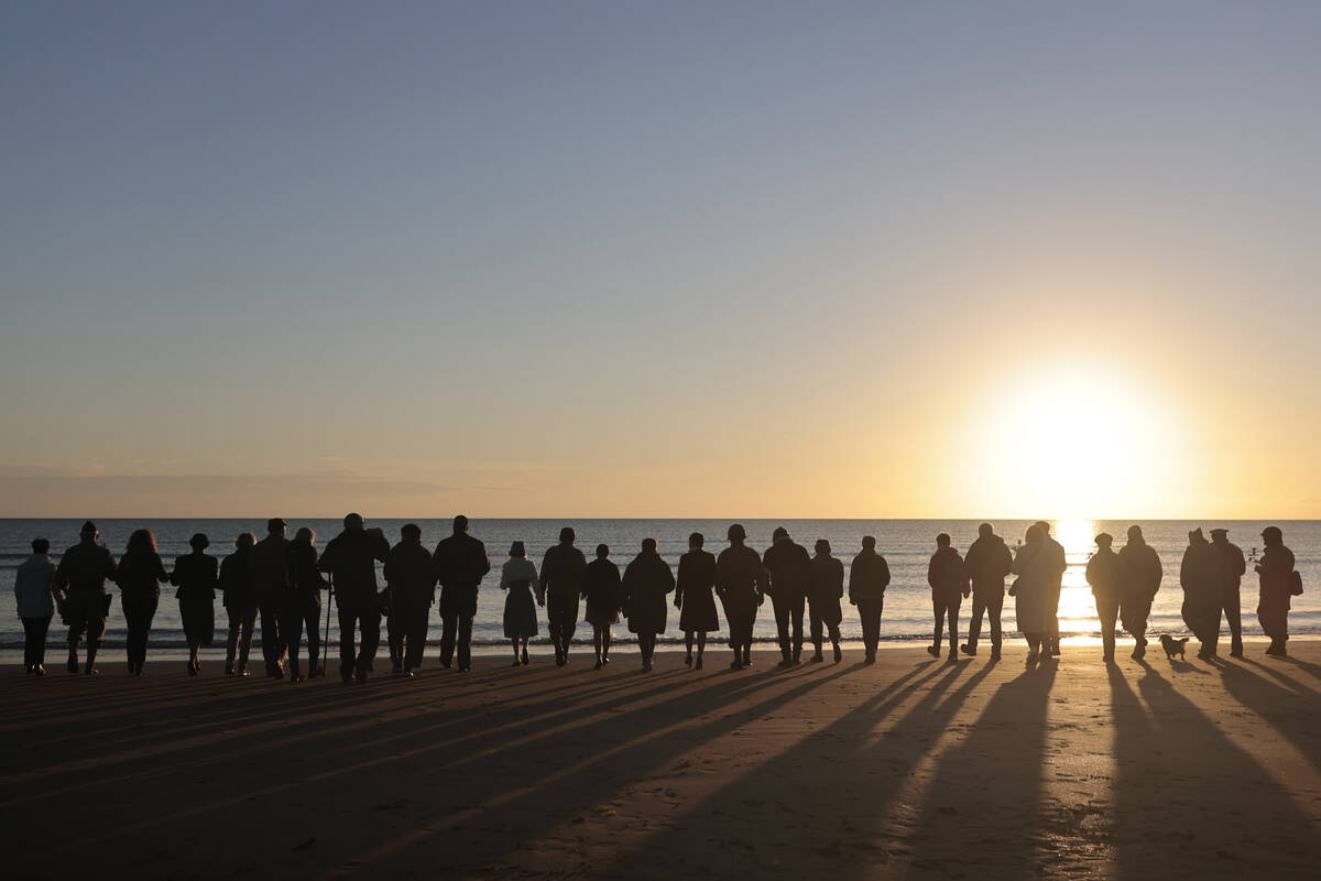 World War II reenactors gather on Omaha Beach in Saint-Laurent-sur-Mer, Normandy, France M ...