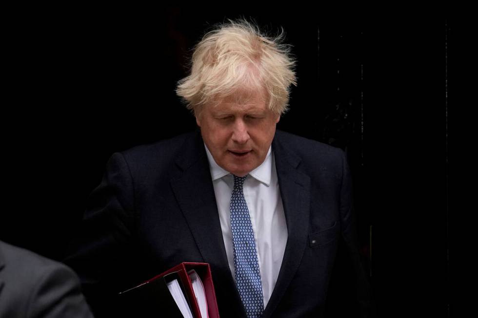 FILE - British Prime Minister Boris Johnson leaves 10 Downing Street to attend the weekly Prime ...