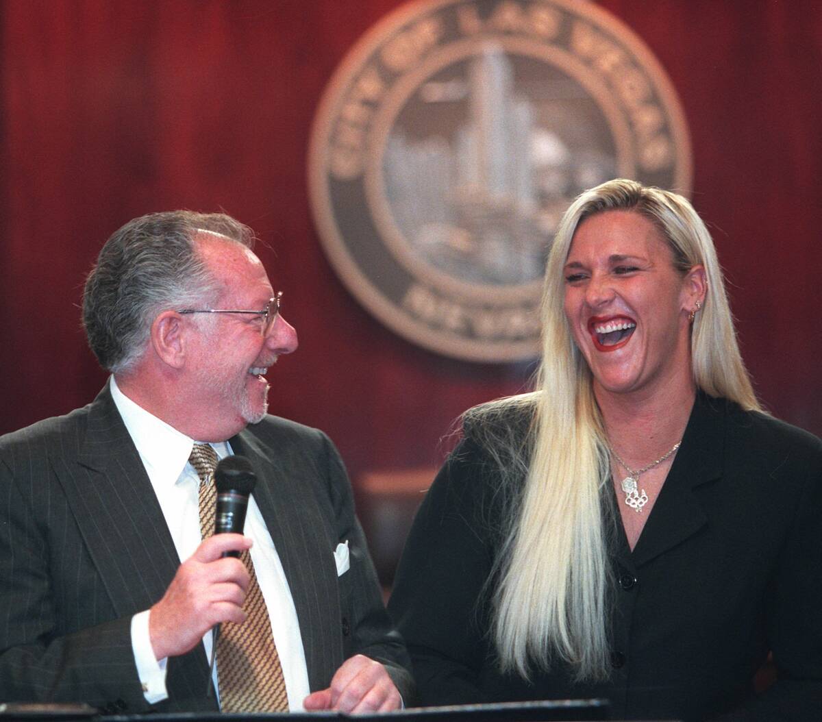 Olympic gold medalist Lori Harrigan and Mayor Oscar Goodman share a laugh at the City Council m ...