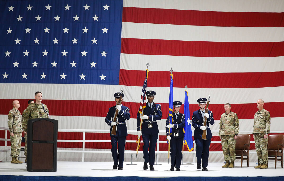 The Air Force honor guard on stage at an assumption of command ceremony at Nellis Air Force Bas ...