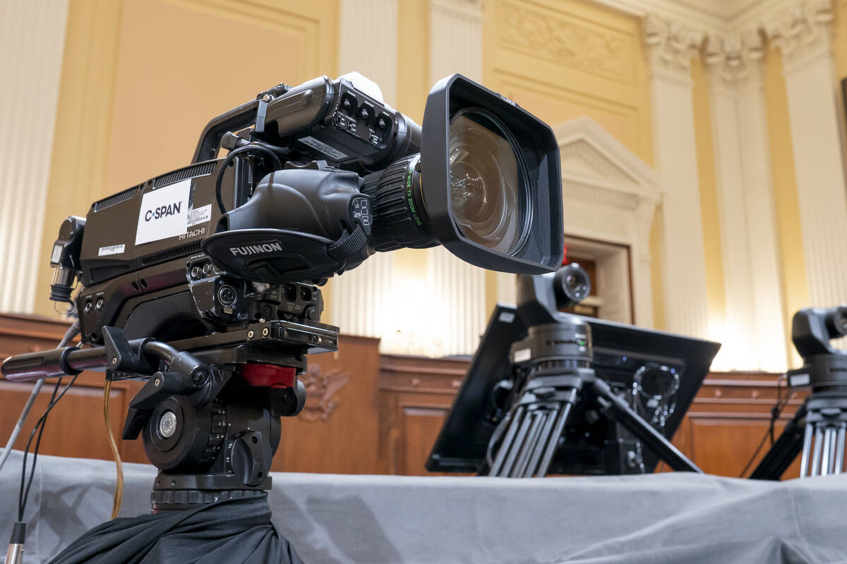 Television crews and technicians prepare the Cannon Caucus Room for Thursday night's hearing by ...