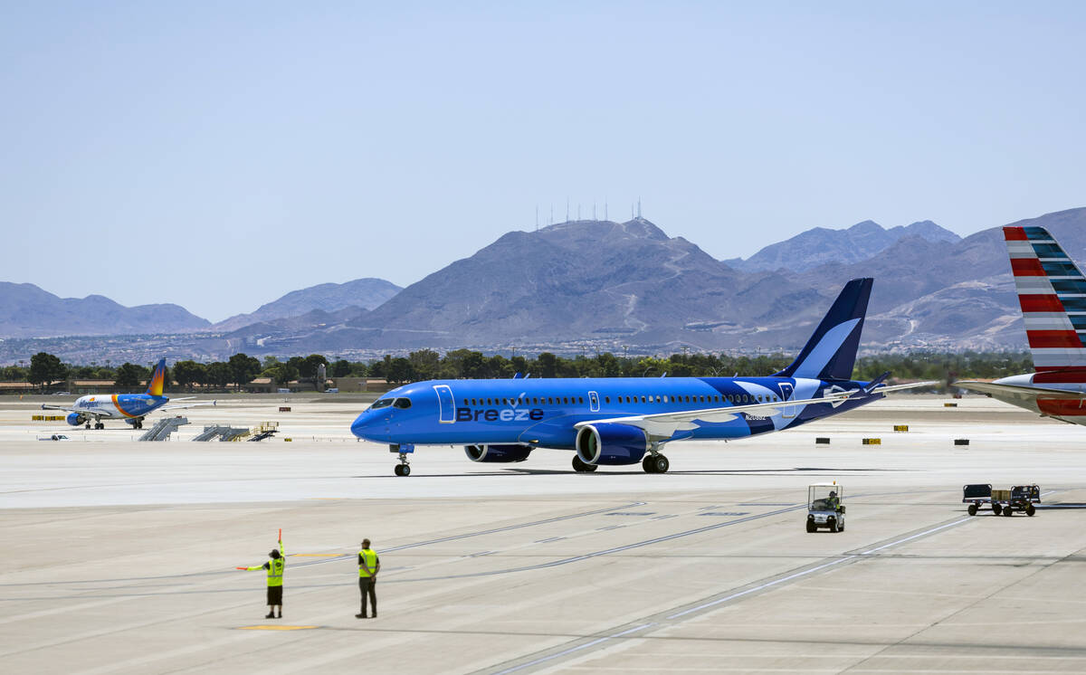 The Breeze Airways inaugural flight arrival taxis to the gate at Harry Reid International Airpo ...